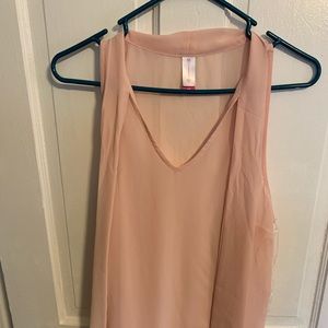 Light pink see-thru blouse.